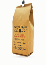 Load image into Gallery viewer, A brown kraft paper coffee bag with a black plastic clip at the top, featuring the Silver Falls Coffee Co. logo and text for Silver Falls Espresso Blend Ground Coffee on a white background.